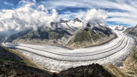 Majestic Glacier Flowing Through Mountain Landscape wallpaper