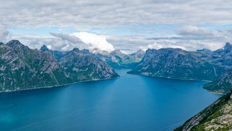 Serene Fjords Embracing Majestic Mountains wallpaper