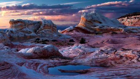 Majestic Rock Formations Under a Colorful Sky wallpaper