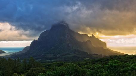 Majestic Mountain Overlooking Serene Waters wallpaper