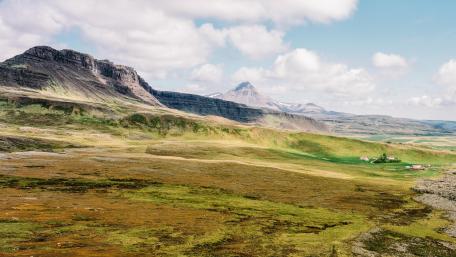 Majestic Mountains Surrounded by Lush Greenery wallpaper