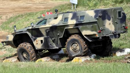 Military Armored Vehicle on Rough Terrain wallpaper