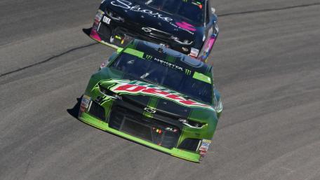 Racing Thrills on the Track with Powerful Machines wallpaper