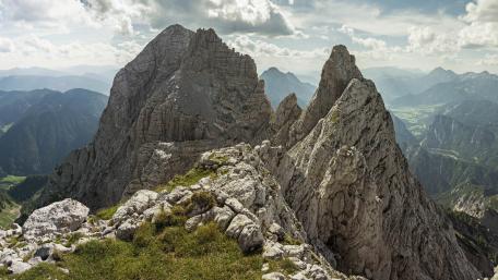 Majestic Mountain Peaks Under a Dramatic Sky wallpaper