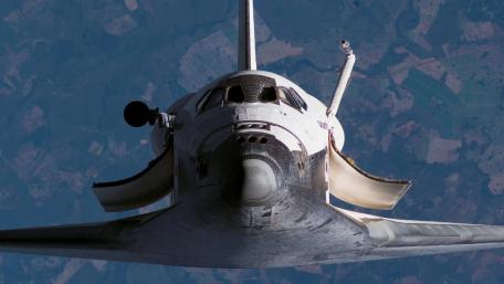 Majestic Space Shuttle in Orbit Above Earth wallpaper