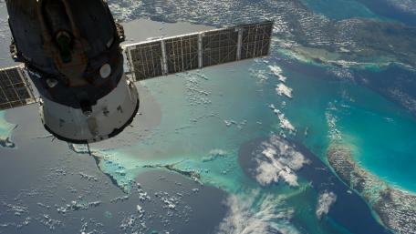Vibrant Earth from Above with Spacecraft Perspective wallpaper