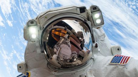 Astronaut Reflections in Space Environment wallpaper