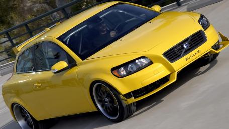 Vibrant Yellow Car in Motion wallpaper