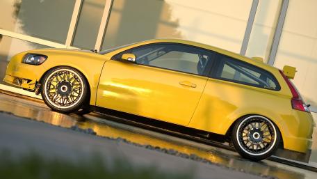 Vibrant Yellow Hatchback Car Wallpaper wallpaper