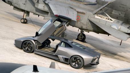 Futuristic Car Meets Military Excellence in Wallpaper wallpaper