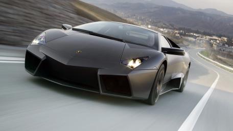 Sleek and Powerful Lamborghini on the Open Road wallpaper