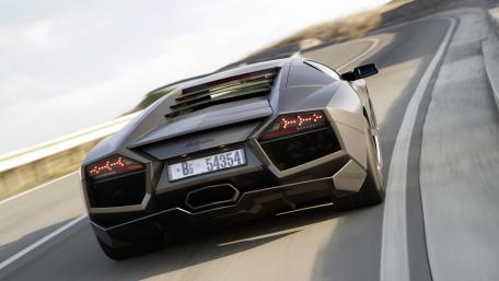 Sleek Lamborghini on a Scenic Roadway wallpaper