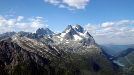 Majestic Peaks Against a Clear Blue Sky wallpaper
