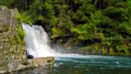 Serenity of a Cascading Waterfall in Lush Greenery wallpaper