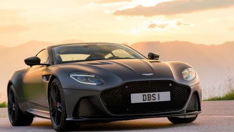 Sleek Aston Martin DBS in Sunset Glow wallpaper