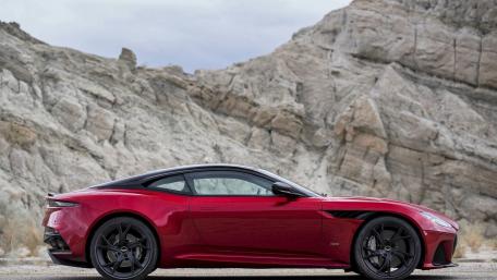 Sleek Red Performance Car in Stunning Landscape wallpaper