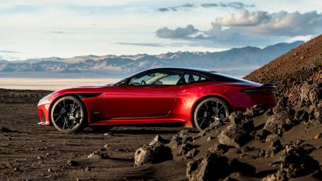 Sleek Red Sports Car in a Stunning Landscape wallpaper