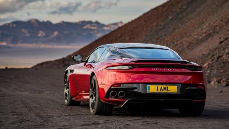 Sleek Aston Martin on a Desert Road wallpaper