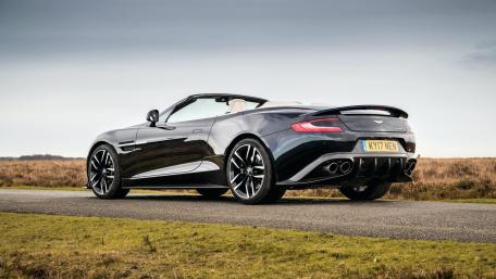 Sleek Convertible Aston Martin in a Scenic Landscape wallpaper