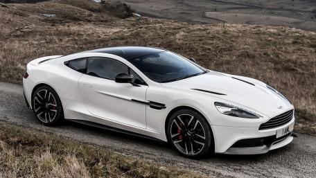 Sleek White Sports Car on Scenic Road wallpaper