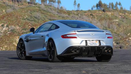 Sleek Silver Sports Car Under Clear Blue Sky wallpaper