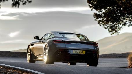 Sleek Aston Martin on a Scenic Road wallpaper