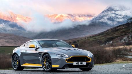 Sleek Aston Martin Against Mountain Backdrop wallpaper