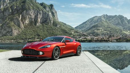 Stunning Red Aston Martin on Serene Lake Shore wallpaper