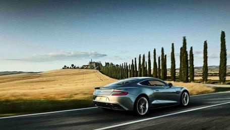 Elegant Drive Through Serene Countryside wallpaper