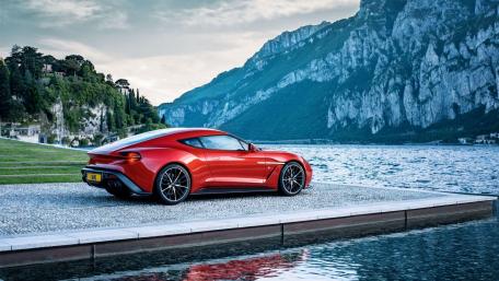 Elegant Red Sports Car by Scenic Lake wallpaper
