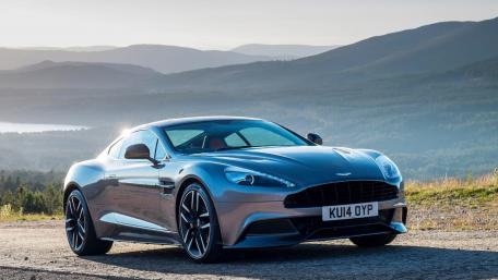 Sleek Aston Martin on Scenic Driveway wallpaper