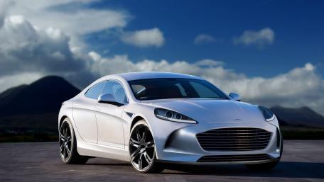 Sleek Silver Sports Car Under Dramatic Skies wallpaper