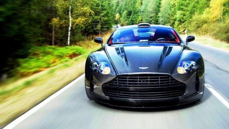 Sleek Carbon Fiber Aston Martin on the Open Road wallpaper
