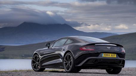 Sleek Aston Martin Against a Scenic Background wallpaper