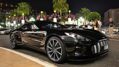 Sleek Luxury Sports Car in Night Scene wallpaper