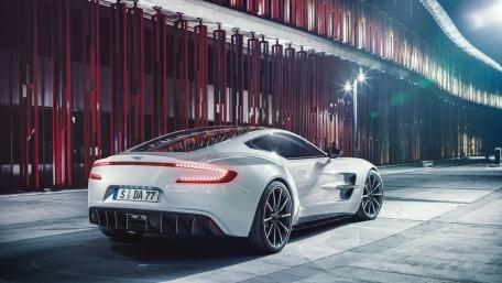 Sleek White Supercar in Urban Nightscape wallpaper