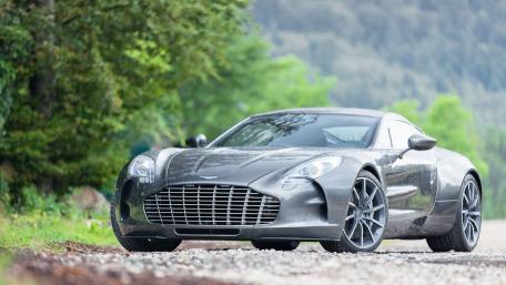 Sleek Aston Martin in Nature's Embrace wallpaper