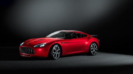 Sleek Red Sports Car in Dramatic Lighting wallpaper