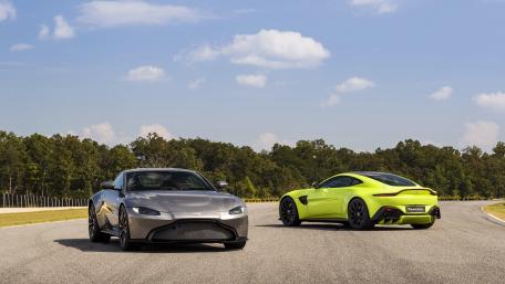 Sleek Aston Martins on the Track wallpaper