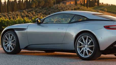 Sleek Silver Sports Car in Scenic Landscape wallpaper