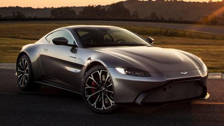 Sleek Aston Martin Sports Car in Sunset Glow wallpaper