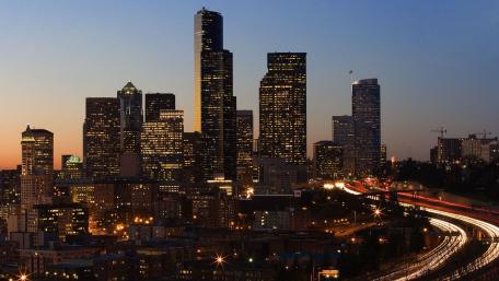 City Skyline at Dusk with Vibrant Lights and Colors wallpaper