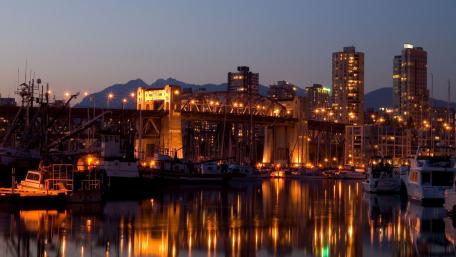 Serene Cityscape Reflected at Night wallpaper