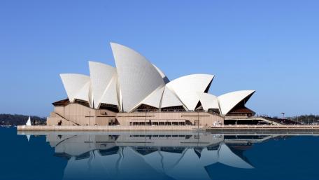 Iconic Sydney Opera House Reflection in Calm Waters wallpaper