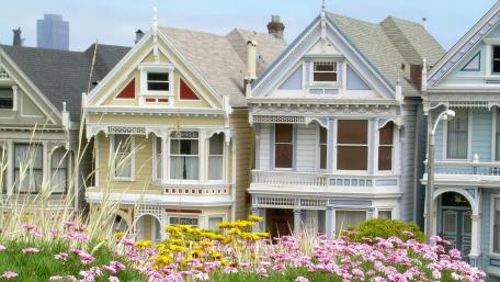 Charming Victorian Homes with Vibrant Flowers wallpaper