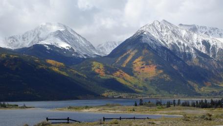 Majestic Mountain Landscape Under Dramatic Skies wallpaper