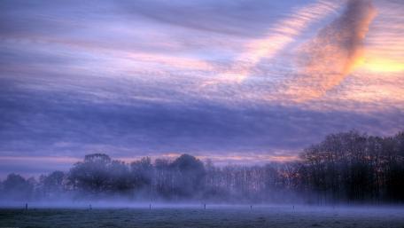 Serene Dawn in Misty Landscape wallpaper