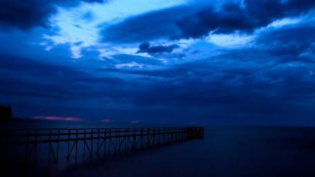 Tranquil Blue Dusk Over the Pier wallpaper