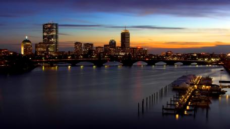 Majestic Cityscape at Dusk Over Water wallpaper