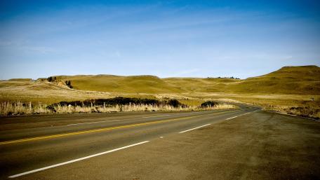 Rolling Hills and Open Roads Awaiting Adventure wallpaper